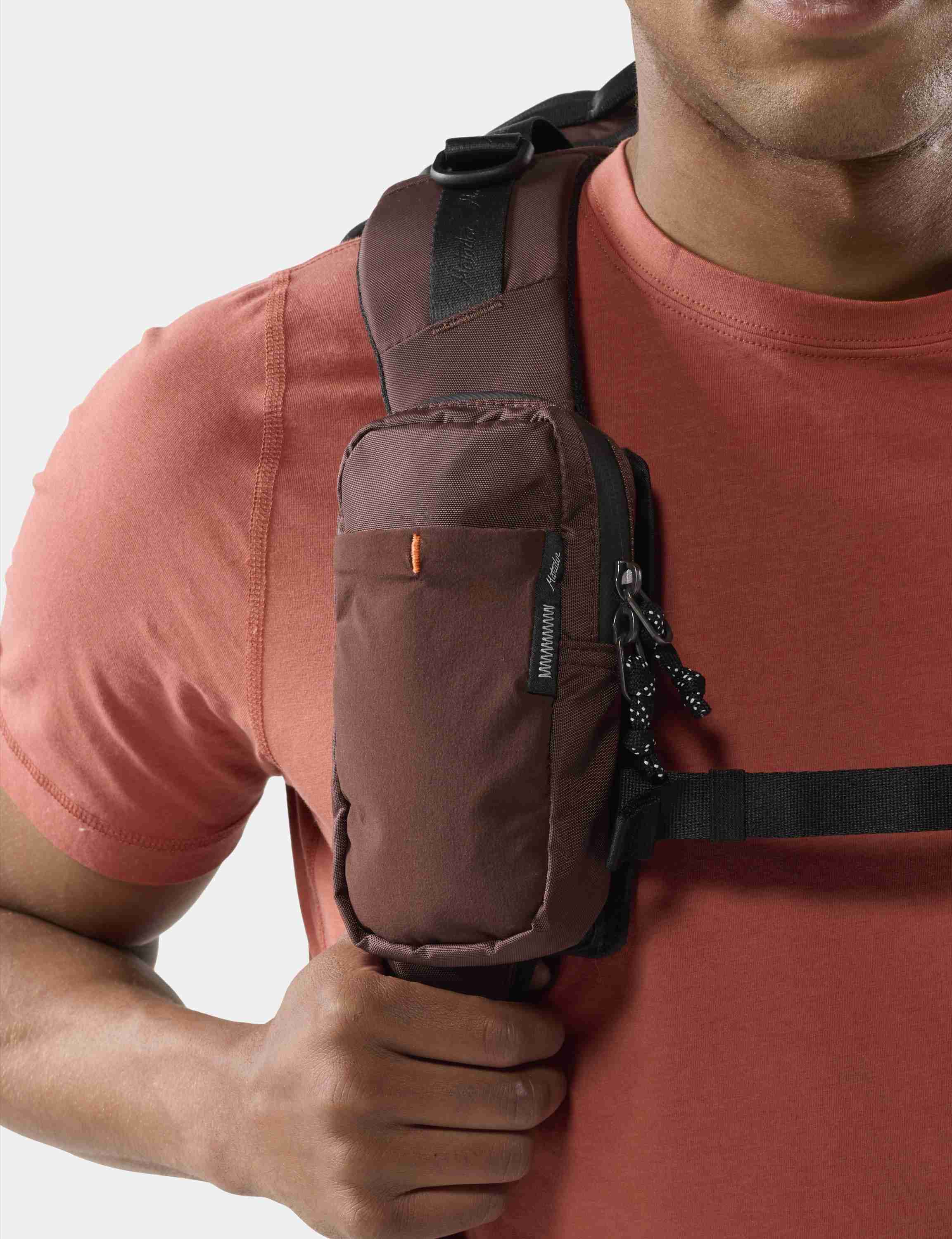 Hydration pack, Chest strap, Shoulder pocket, Brown pouch, Outdoor gear